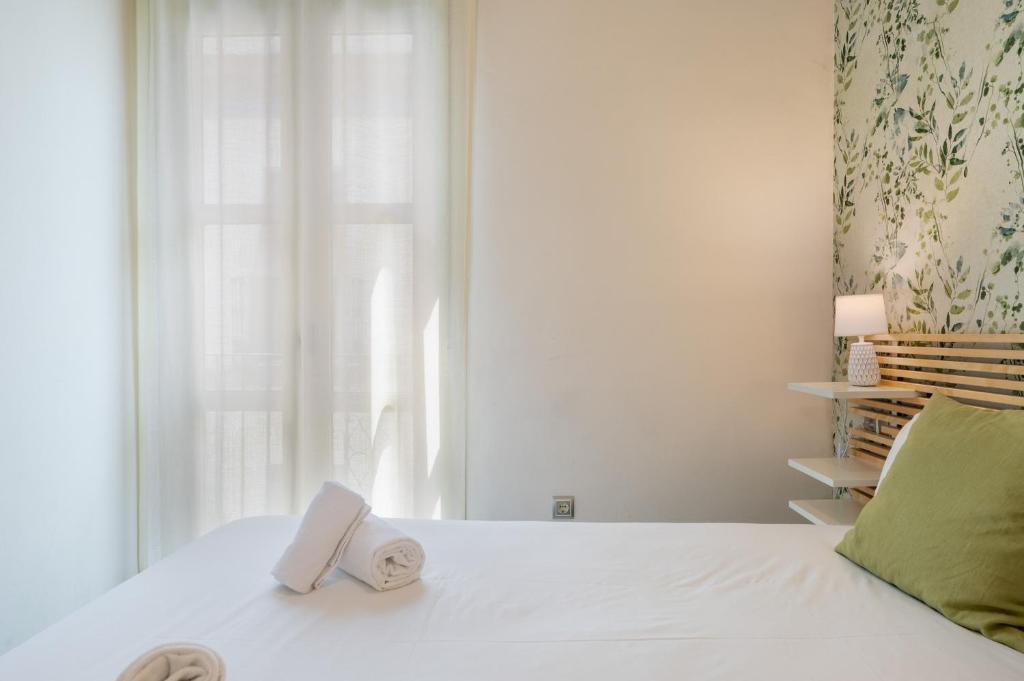 Posteľ alebo postele v izbe v ubytovaní San Julian Apartment
