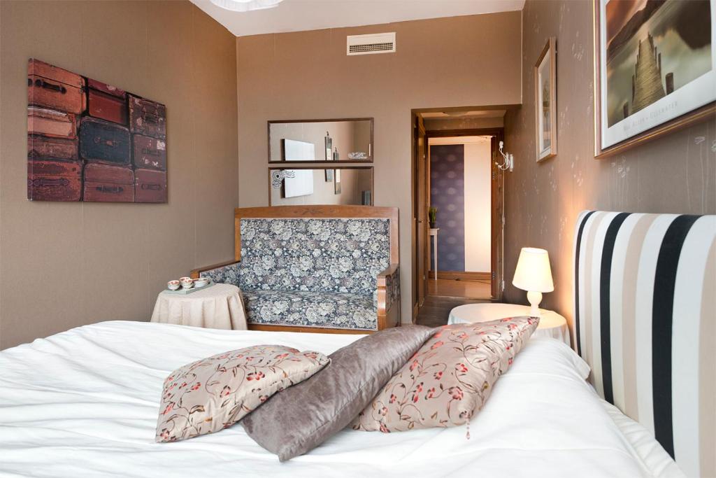 Postel nebo postele na pokoji v ubytování Hotell Aina