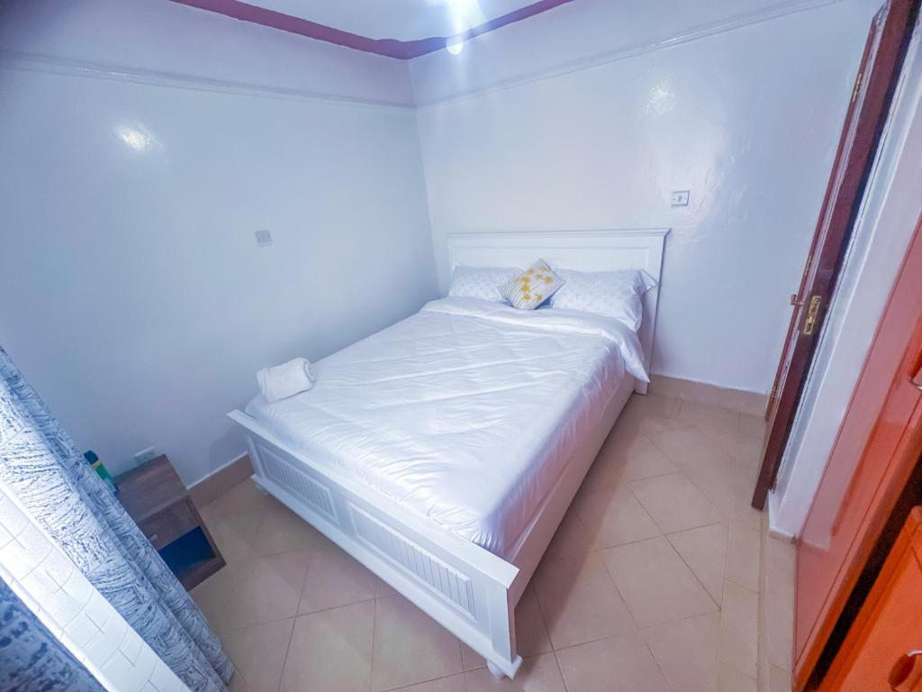 Postel nebo postele na pokoji v ubytování Cosy 1 bedrooms, Hells Gate Moi South Lake Naivasha