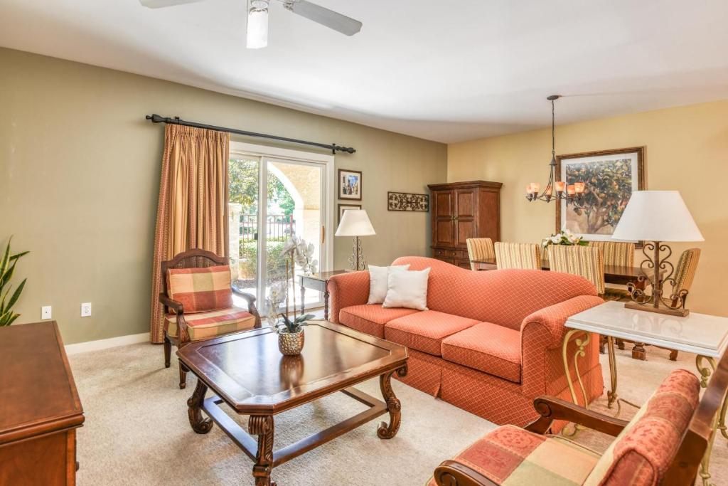 a living room with a couch and a table at 4106-1 Cozy Ground Floor 1 BR with fenced patio in Saint Augustine