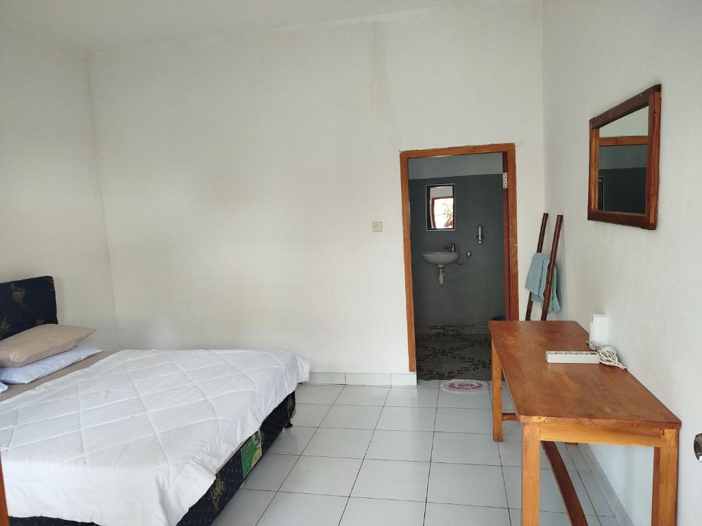 Postel nebo postele na pokoji v ubytování Tatasya homestay