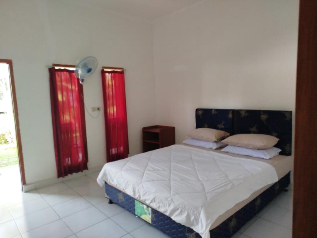 Postel nebo postele na pokoji v ubytování Tatasya homestay