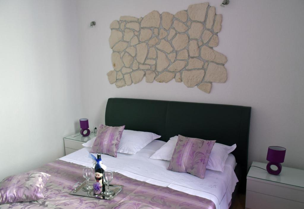 Posteľ alebo postele v izbe v ubytovaní Kuzma Rooms and Apartments