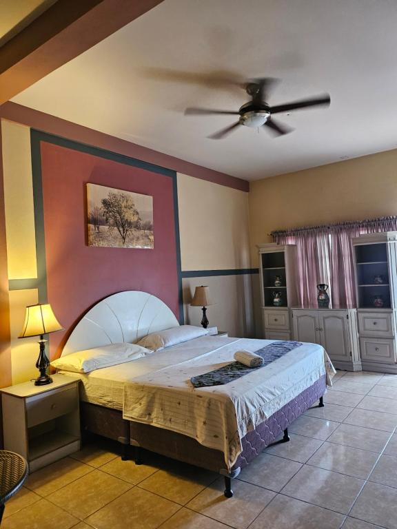 Postel nebo postele na pokoji v ubytování Platinum Hotel