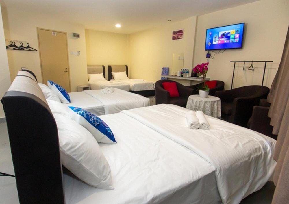 Una cama o camas en una habitación de Southern Tip Hotel