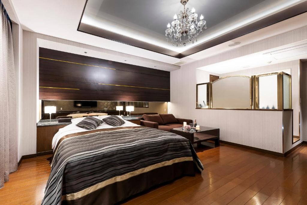 Postel nebo postele na pokoji v ubytování Hotel MYTH-L&A-ホテル マイス エルアンドエー