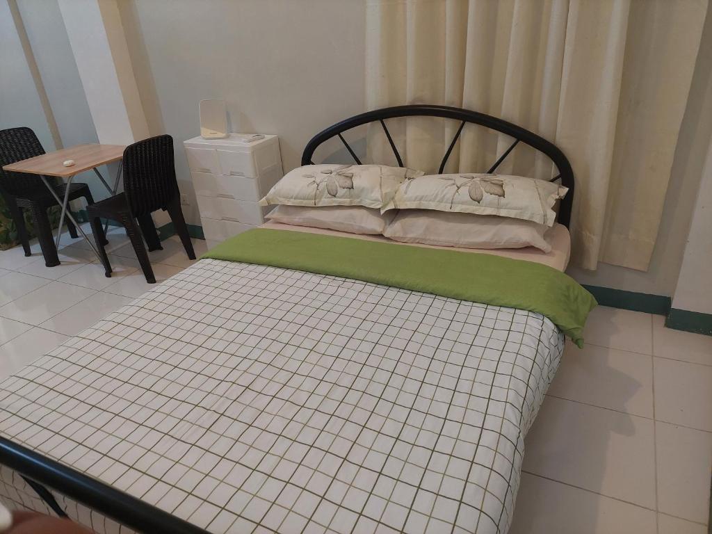 Postel nebo postele na pokoji v ubytování GGGO RESIDENCES, Studio 103, King