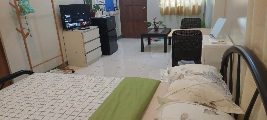 Postel nebo postele na pokoji v ubytování GGGO RESIDENCES, Studio 103, King
