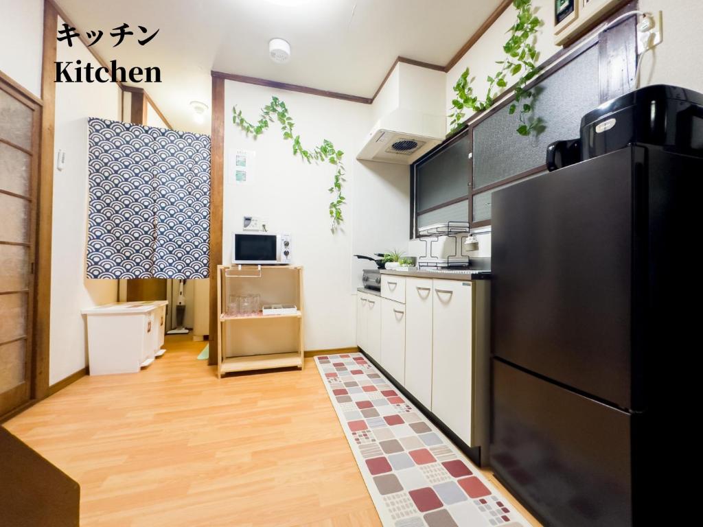 Kuchyň nebo kuchyňský kout v ubytování #池袋駅無料送迎サービス #上野14分丨日暮里10分丨一棟貸切丨最大7名# Ikebukuro Free Pickup#Ueno 14 mins 丨Nippori 10 mins 丨Entire property丨Up to 7 guests 丨B