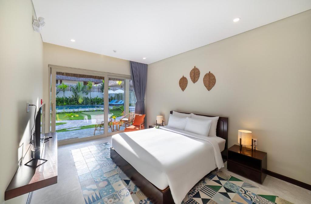 TV/trung tâm giải trí tại Coco Cottage Beachfront Resort