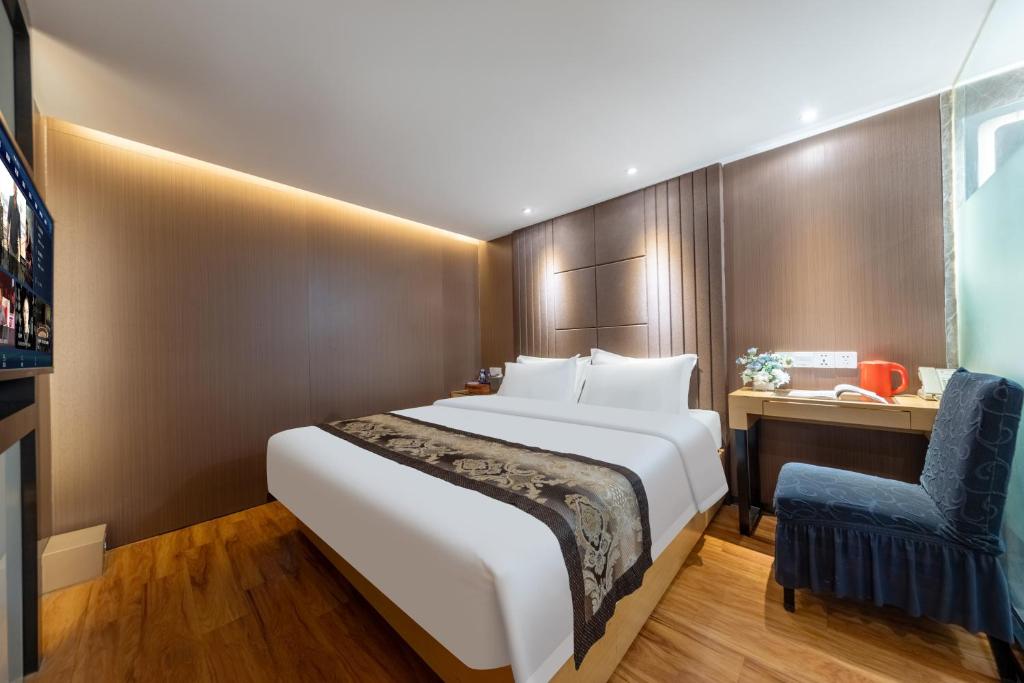Postel nebo postele na pokoji v ubytování XW Hotel