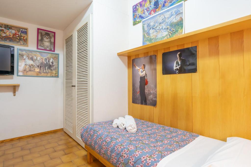Postel nebo postele na pokoji v ubytování Il Giardino di Via Parrocchiale