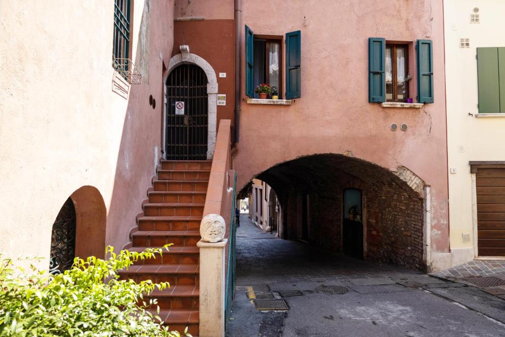 an alley with stairs leading up to a building at Carpione By Case al Lago in Desenzano del Garda
