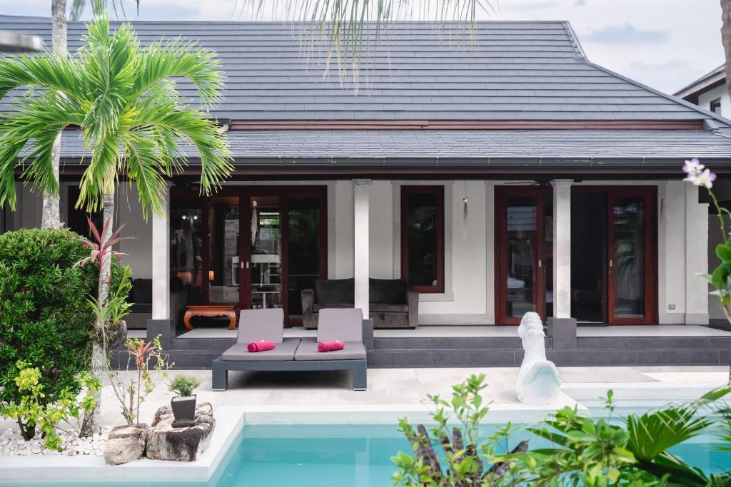 a villa with a pool and a house at Villa Banyak | Luxury 4Br villa with nice terrace and personal playground in Ban Saiyuan (1)