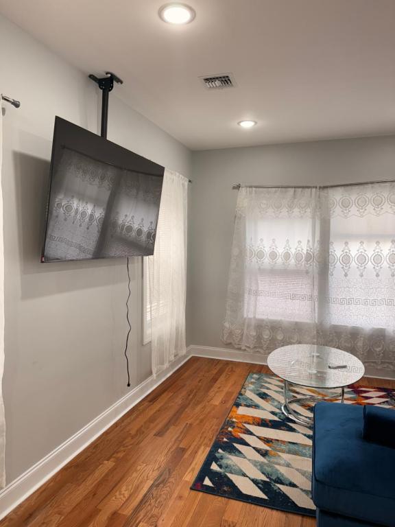 TV a/nebo společenská místnost v ubytování Excel homes