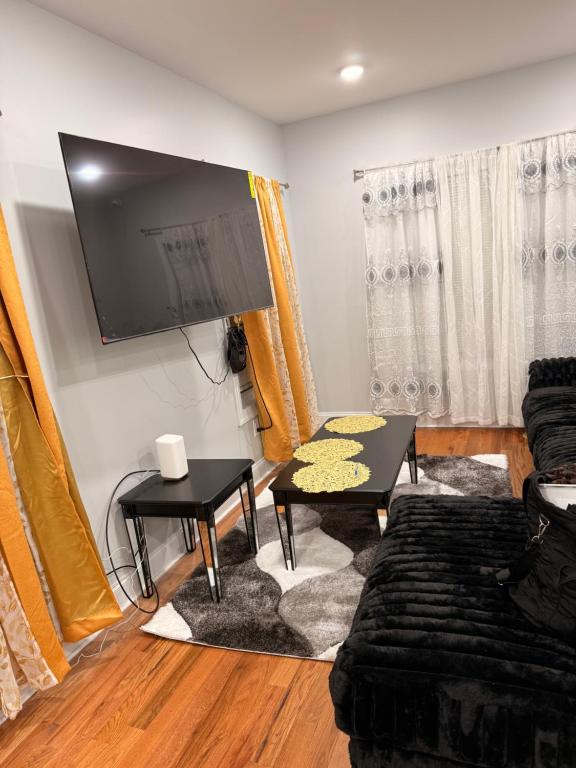 TV a/nebo společenská místnost v ubytování Excel homes
