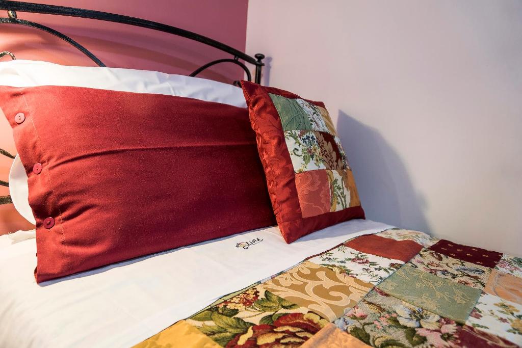 Postel nebo postele na pokoji v ubytování B&B Liolà