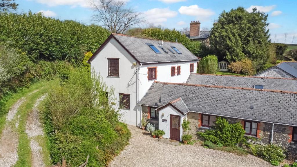 an overhead view of a white cottage on a hill at Sheepfold Cottage Dulverton in Dulverton