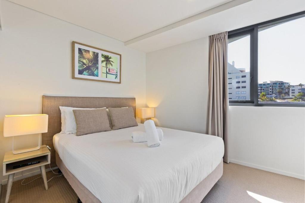 Ένα ή περισσότερα κρεβάτια σε δωμάτιο στο Breeze Mooloolaba (APT 503)