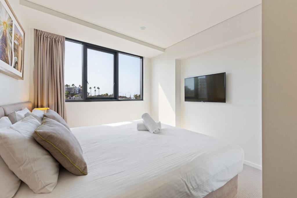 Ένα ή περισσότερα κρεβάτια σε δωμάτιο στο Breeze Mooloolaba (APT 503)