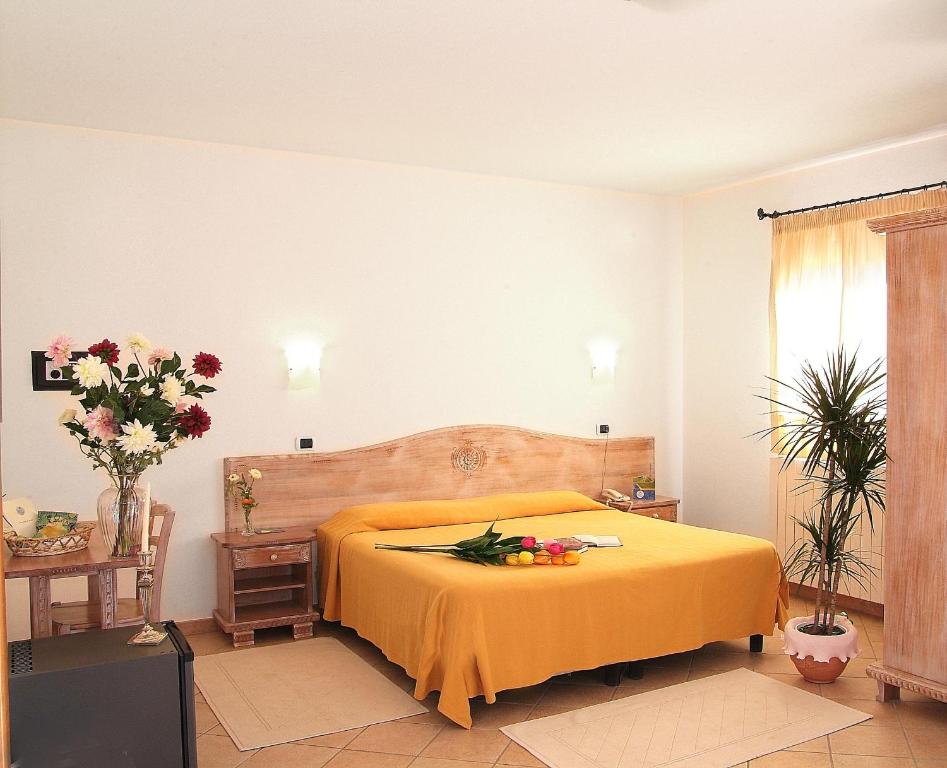 Łóżko lub łóżka w pokoju w obiekcie Hotel Delle Isole
