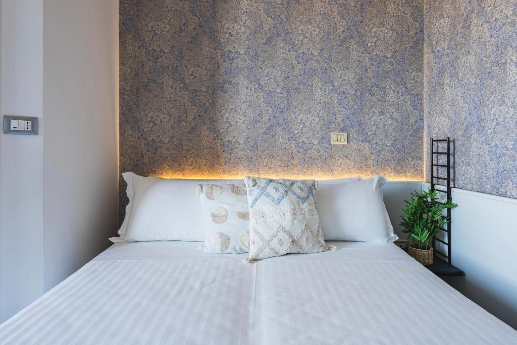 Postel nebo postele na pokoji v ubytování Hotel Acropolis