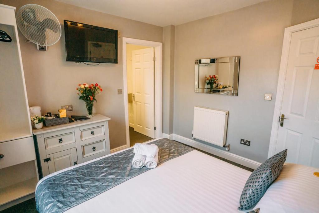 Postel nebo postele na pokoji v ubytování OYO Minerva Guesthouse
