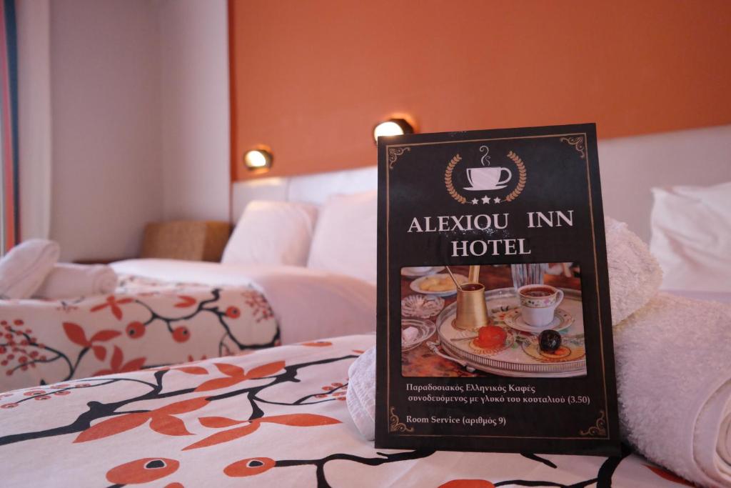 Postel nebo postele na pokoji v ubytování Alexiou Hotel