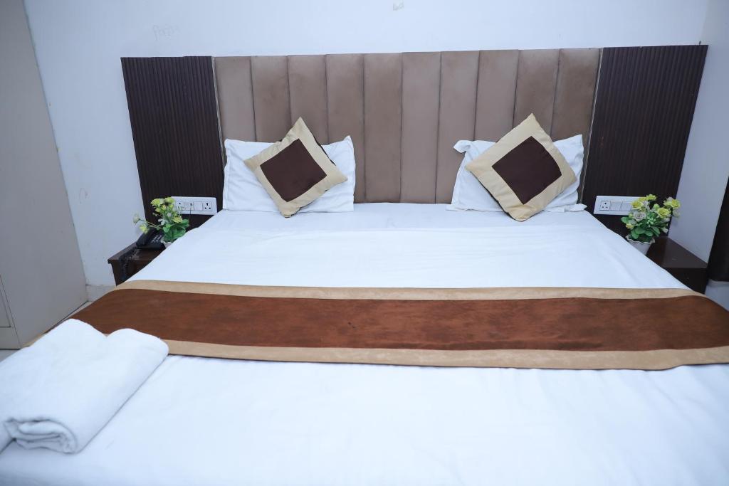 Postel nebo postele na pokoji v ubytování Hotel Green Apple BAREILLY