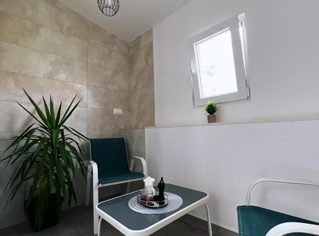 Posedenie v ubytovaní Apartments & Rooms Tapera