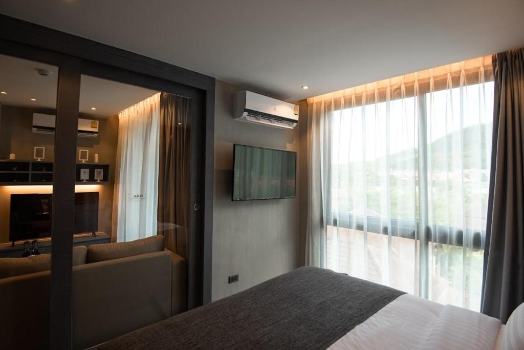 TV a/nebo společenská místnost v ubytování Квартира 1спальня CitygateKamala D508 IBG Property