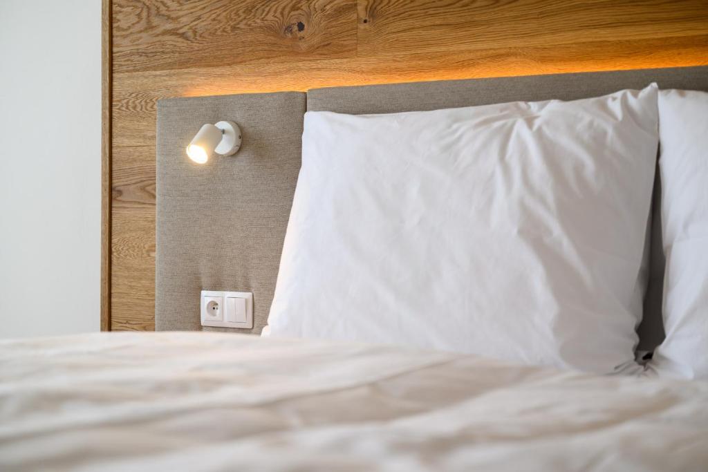 Postel nebo postele na pokoji v ubytování Hotel Schreiner
