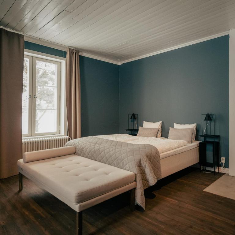 Postel nebo postele na pokoji v ubytování Stilleben Hotell