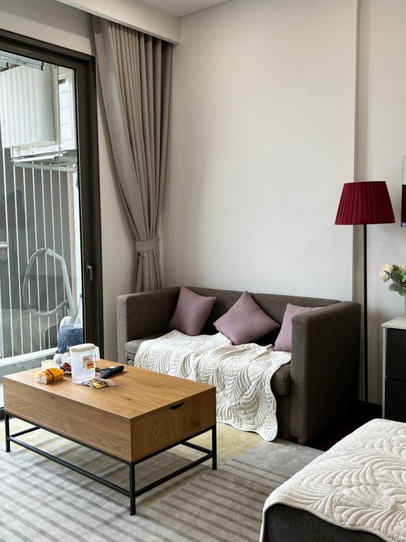 Ένα ή περισσότερα κρεβάτια σε δωμάτιο στο Camcam homestay