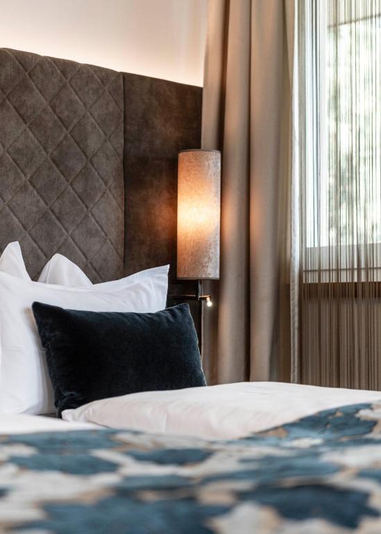 Postel nebo postele na pokoji v ubytování Boutique Hotel Eschenlohe