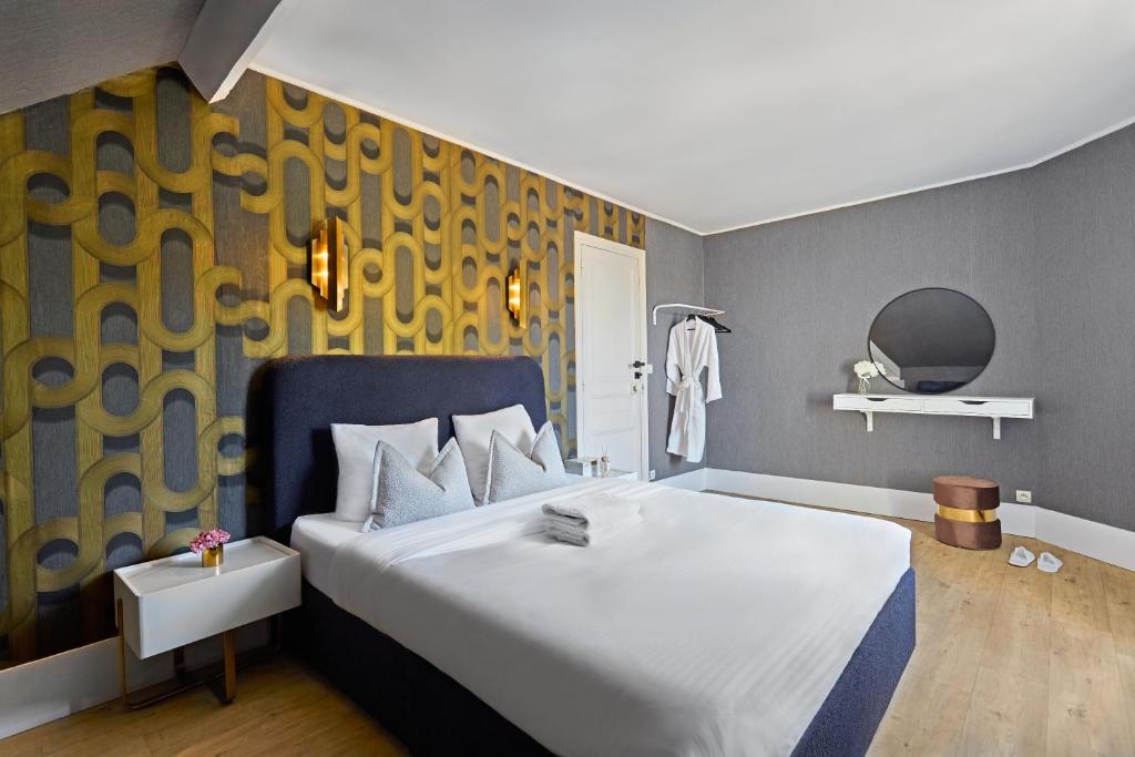 Giường trong phòng chung tại RESIDENCE WAVES Paris Orly Aéroport