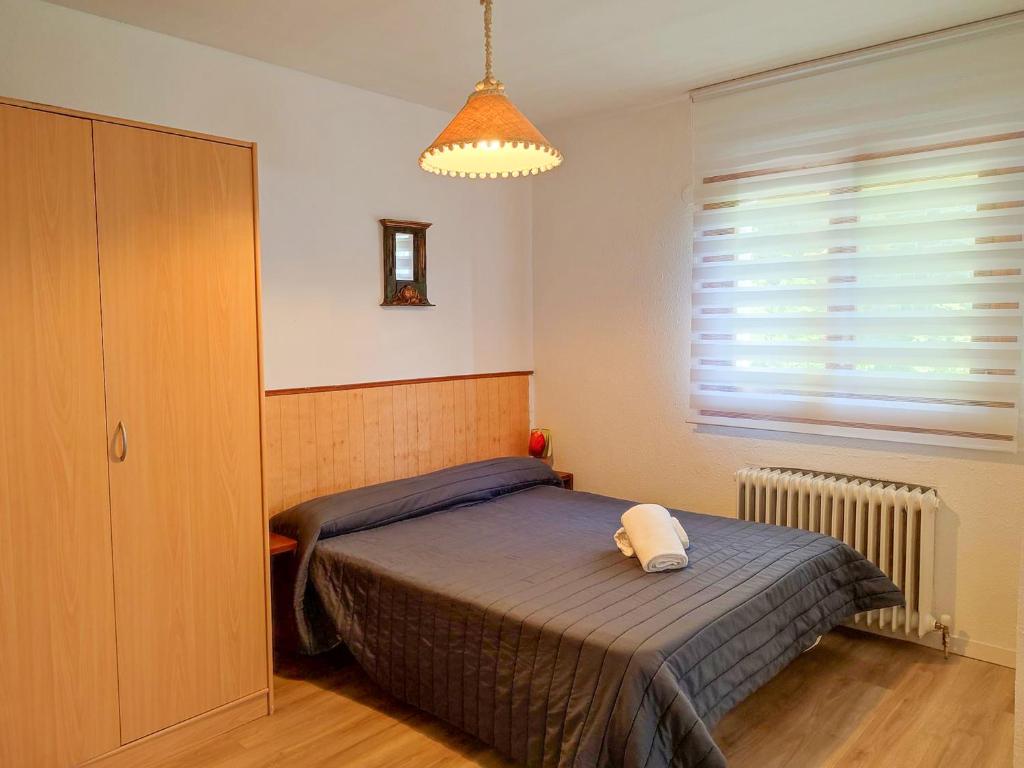Postel nebo postele na pokoji v ubytování Apartamentos 3000 Formigal