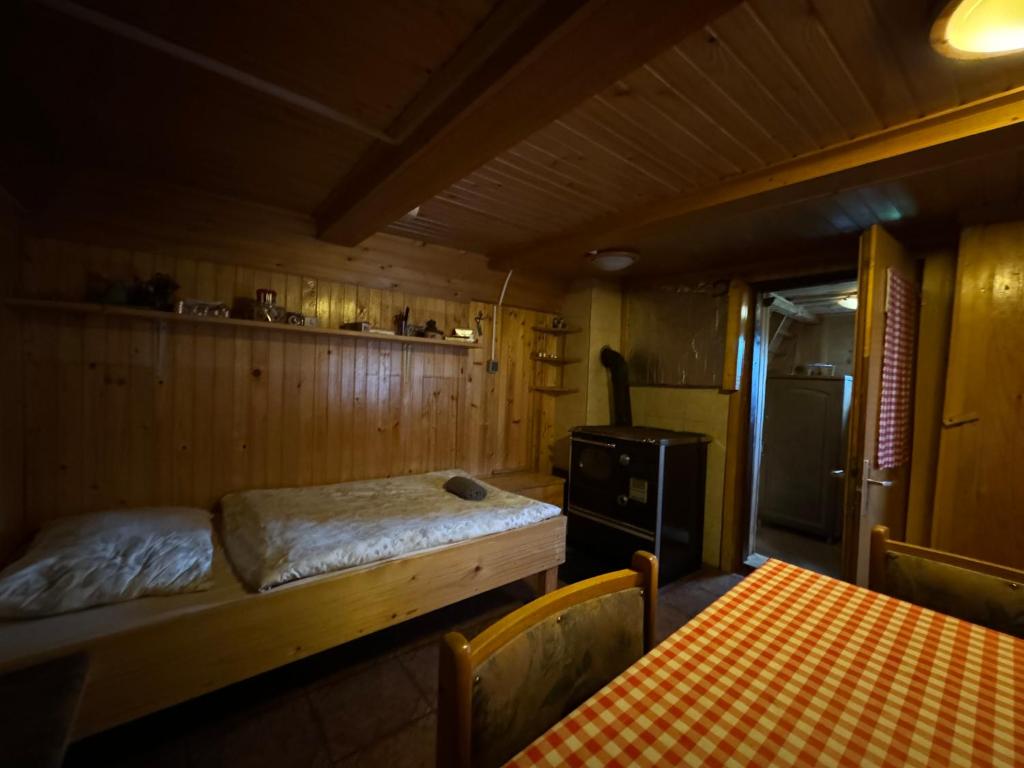 Postel nebo postele na pokoji v ubytování Mountain Lodge Suška Koča
