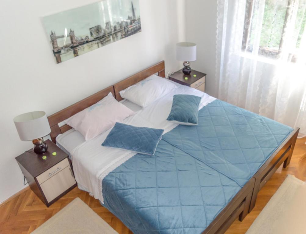 Postel nebo postele na pokoji v ubytování Aneta Apartments