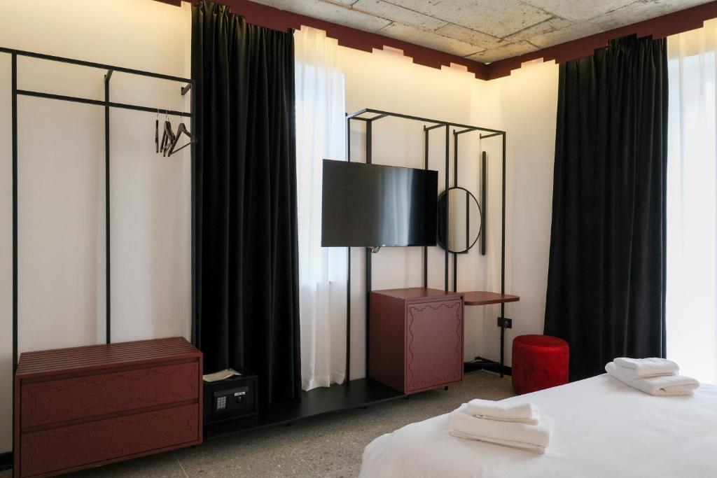 Postel nebo postele na pokoji v ubytování Bazaar Hotel