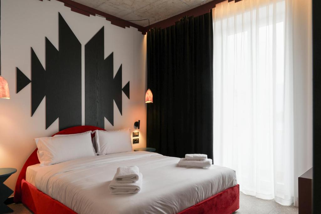 Postel nebo postele na pokoji v ubytování Bazaar Hotel