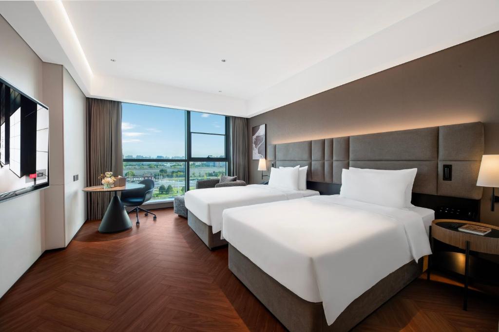 Xi'an Ancient Ming City Wall Premium IntercityHotel客房内的一张或多张床位