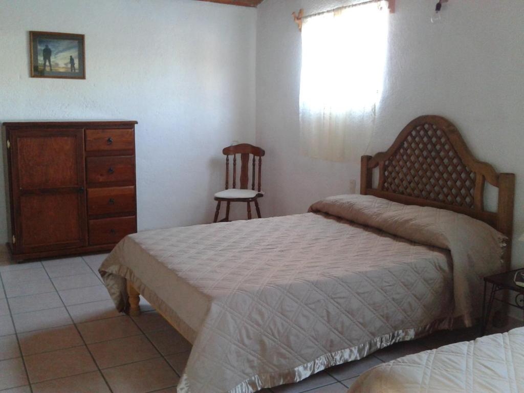 Postel nebo postele na pokoji v ubytování Manzano B&B