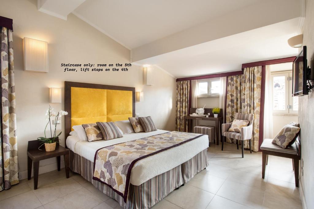Postel nebo postele na pokoji v ubytování Hotel Perseo
