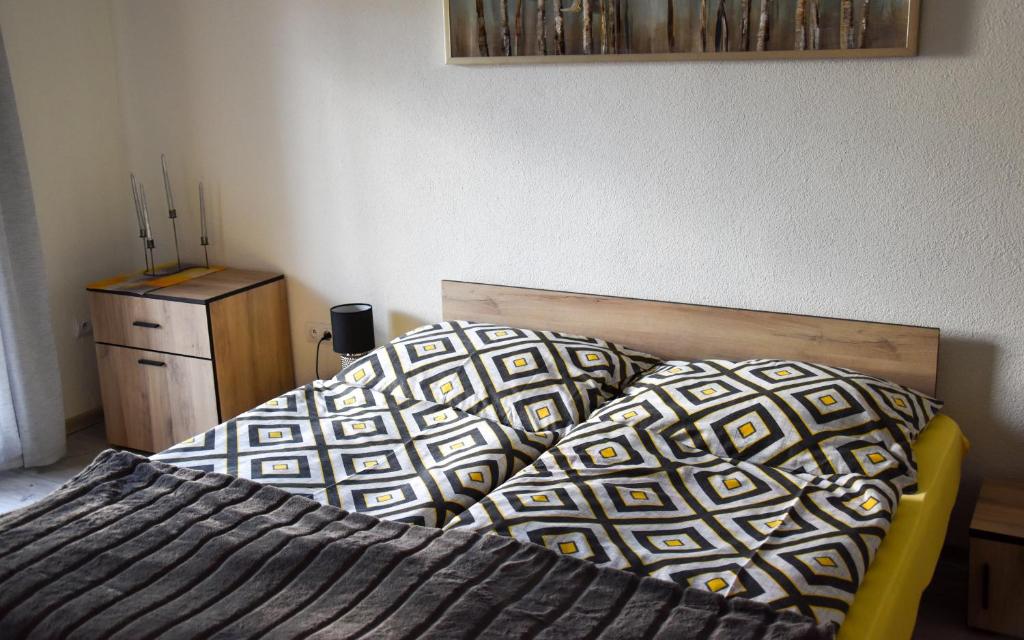 A bed or beds in a room at Apartmán u Braňa
