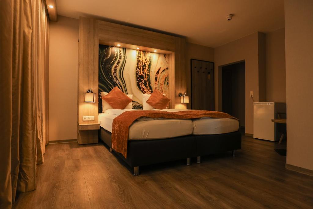 Postel nebo postele na pokoji v ubytování Liebig-Hotel