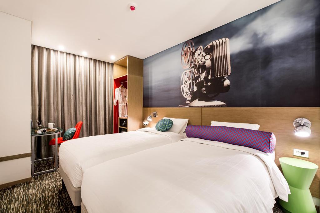 Postel nebo postele na pokoji v ubytování ibis Styles Ambassador Seoul Myeong-dong