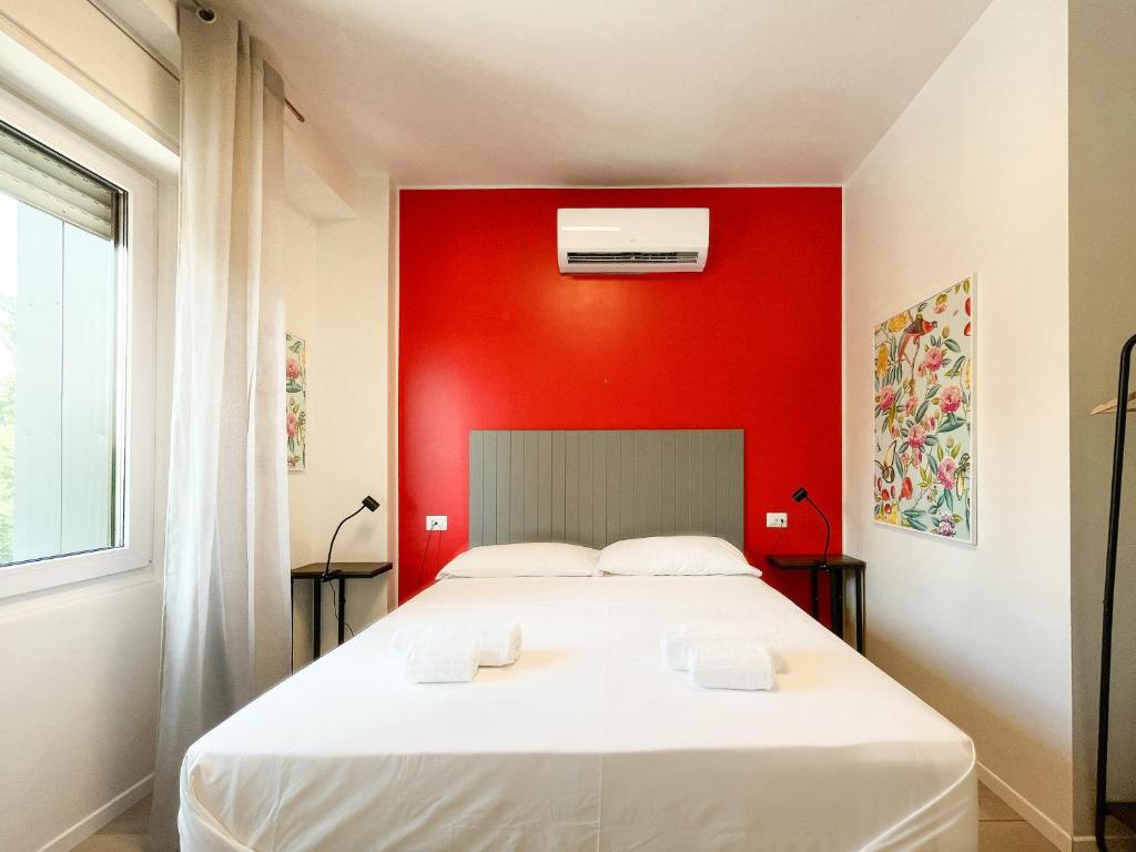 Postel nebo postele na pokoji v ubytování RRRapido Colorful Rooms - Assago