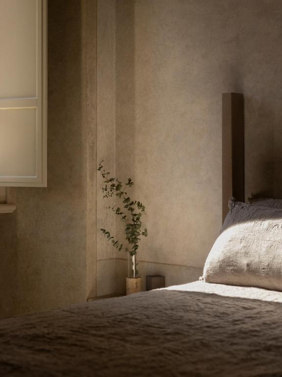 Postel nebo postele na pokoji v ubytování Nomos Hotel