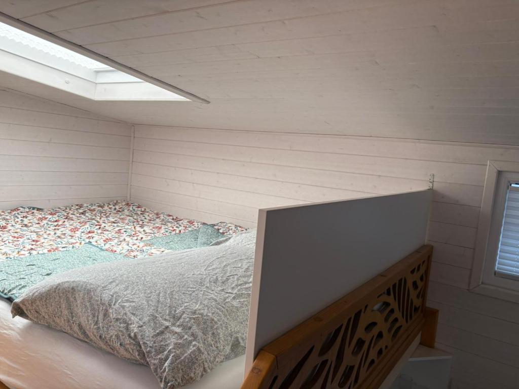 Postel nebo postele na pokoji v ubytování Tiny House am See